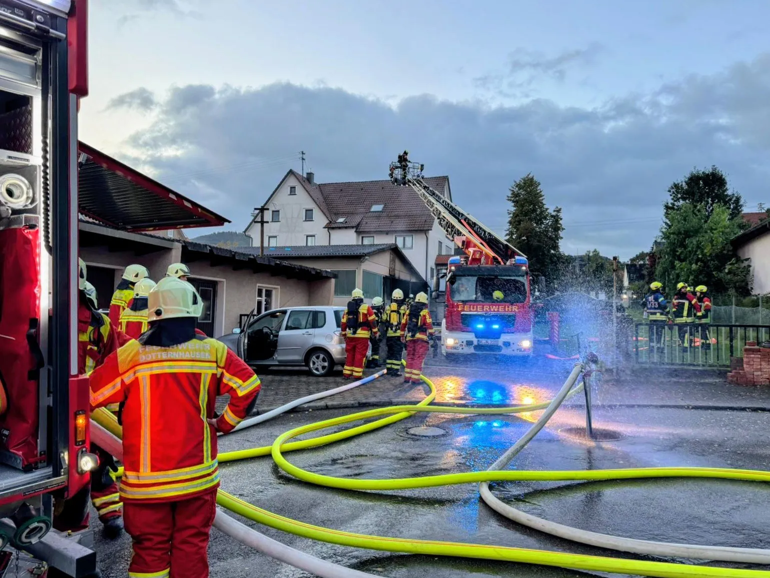 Firefighters at work with a turntable ladder